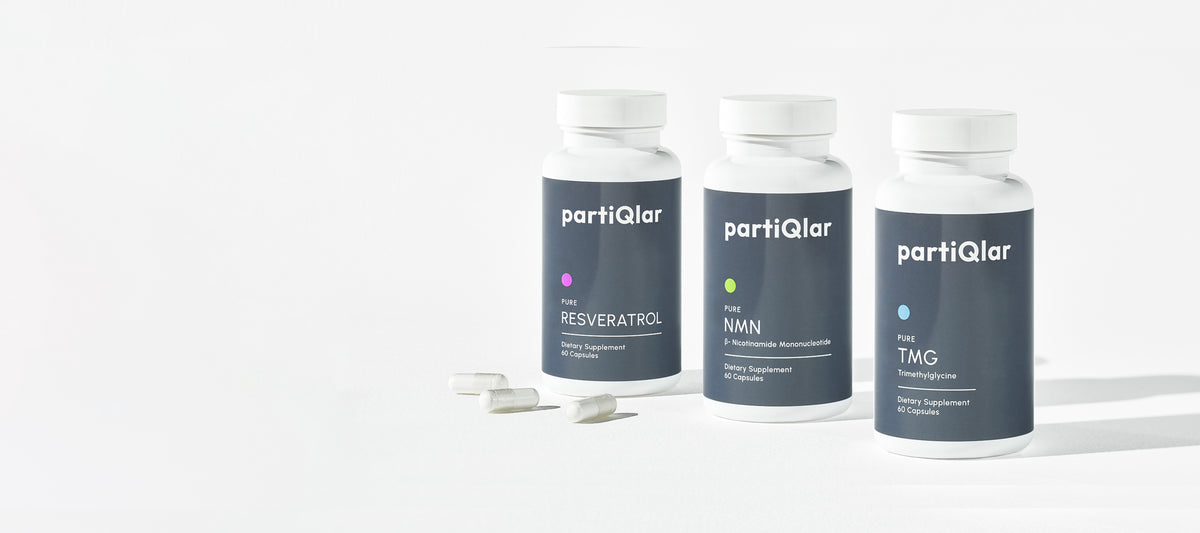 Three partiQlar supplement bottles on a white background