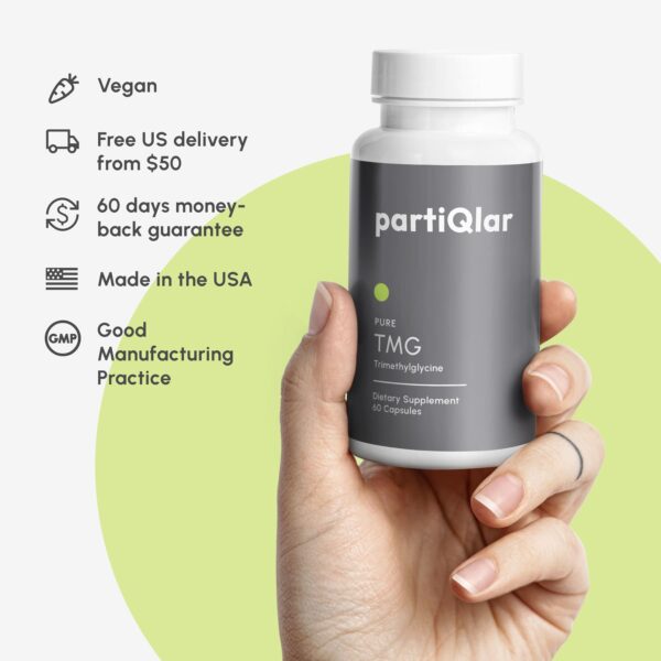 Description of partiQlar Pure TMG Trimethylglycine explaining that it is vegan, free delivery offered, made in USA, good manufacturing practice, hand holding bottle of partiQlar Pure TMG Trimethylglycine in the background