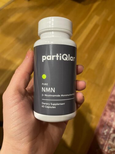 Picture of partiQlar NMN supplement in women's hand