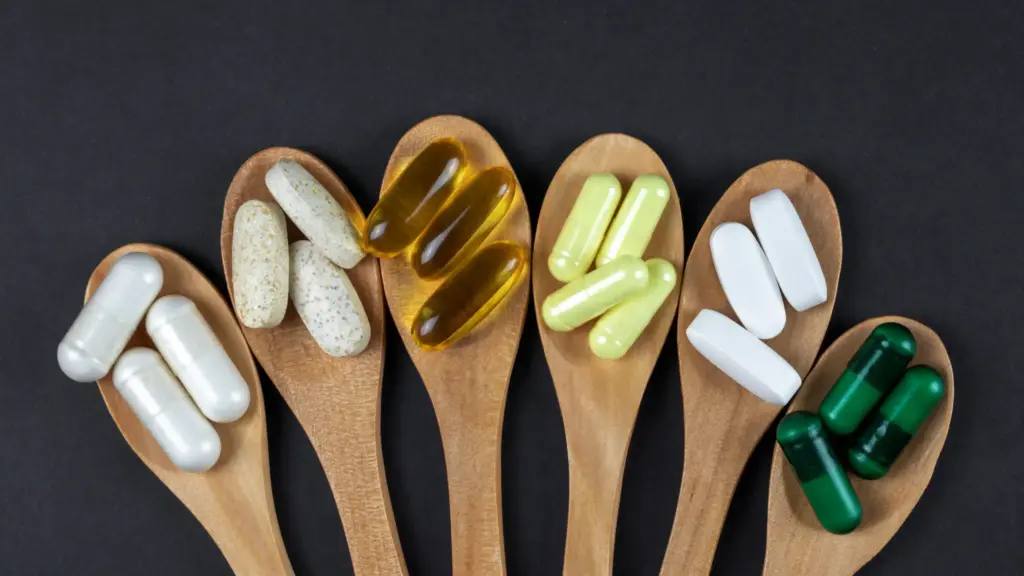 6 different supplements on wooden spoons