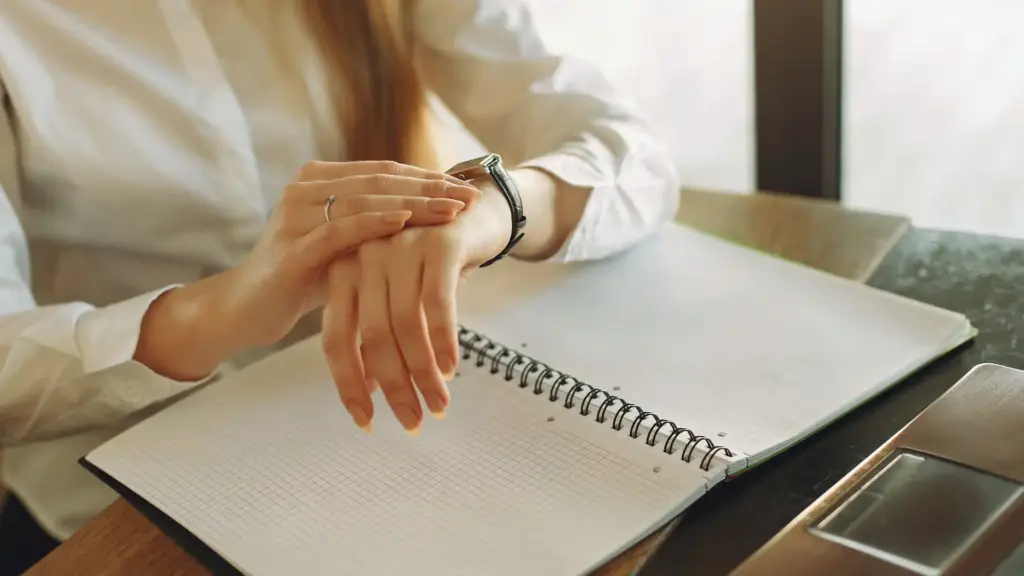 woman checking the time on her wrist