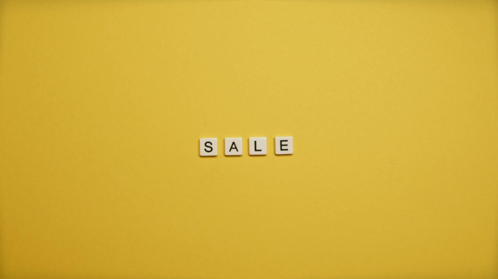 letters spelling out sale in the yellow background