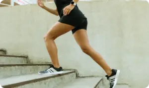 fit woman doing cardio on the stairs