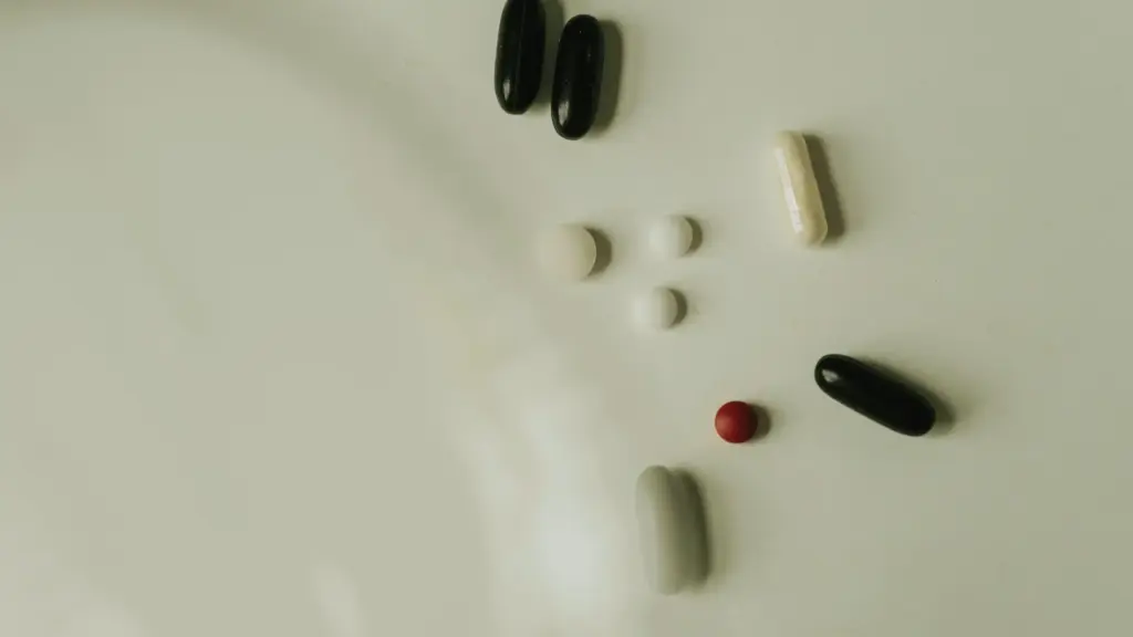 Flat surface with an assortment of colorful supplement capsules.