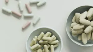 3 piles of different supplements placed on a flat surface