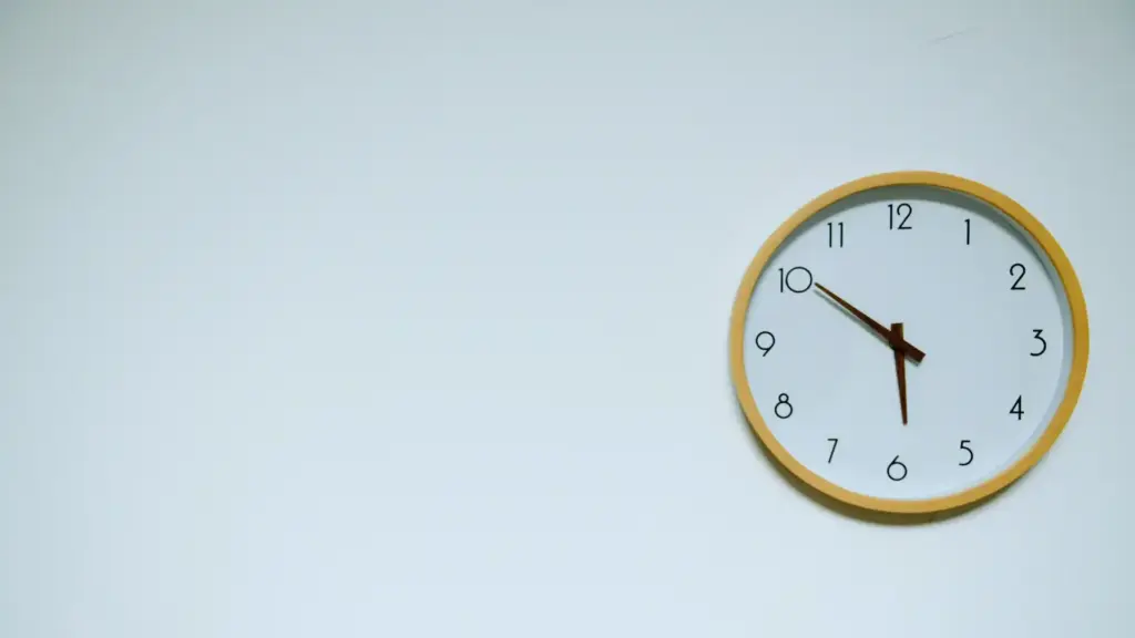 clock placed on a white wall