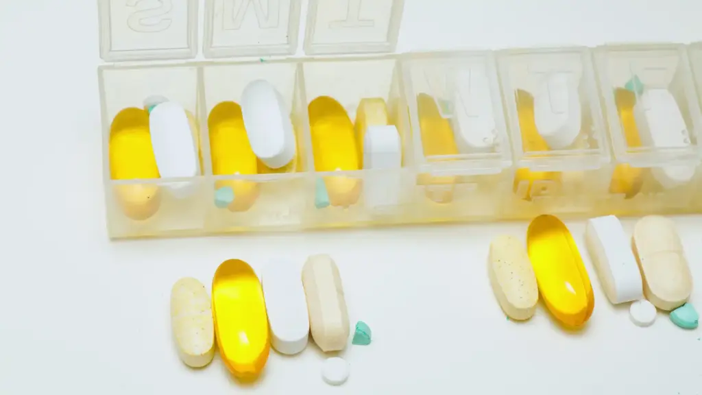 Various supplements neatly arranged in a weekly pill organizer