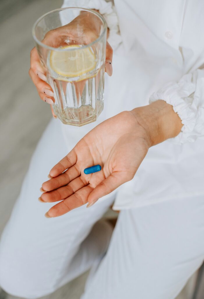 Woman taking NAC or NMN pill