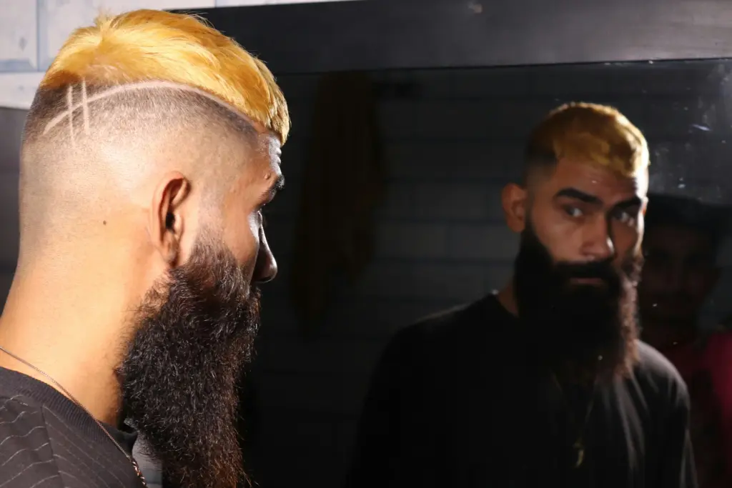 A man checking his hair growth